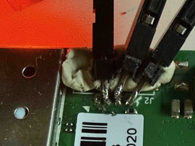 **Insert photo of PCB with markings for serial port**
